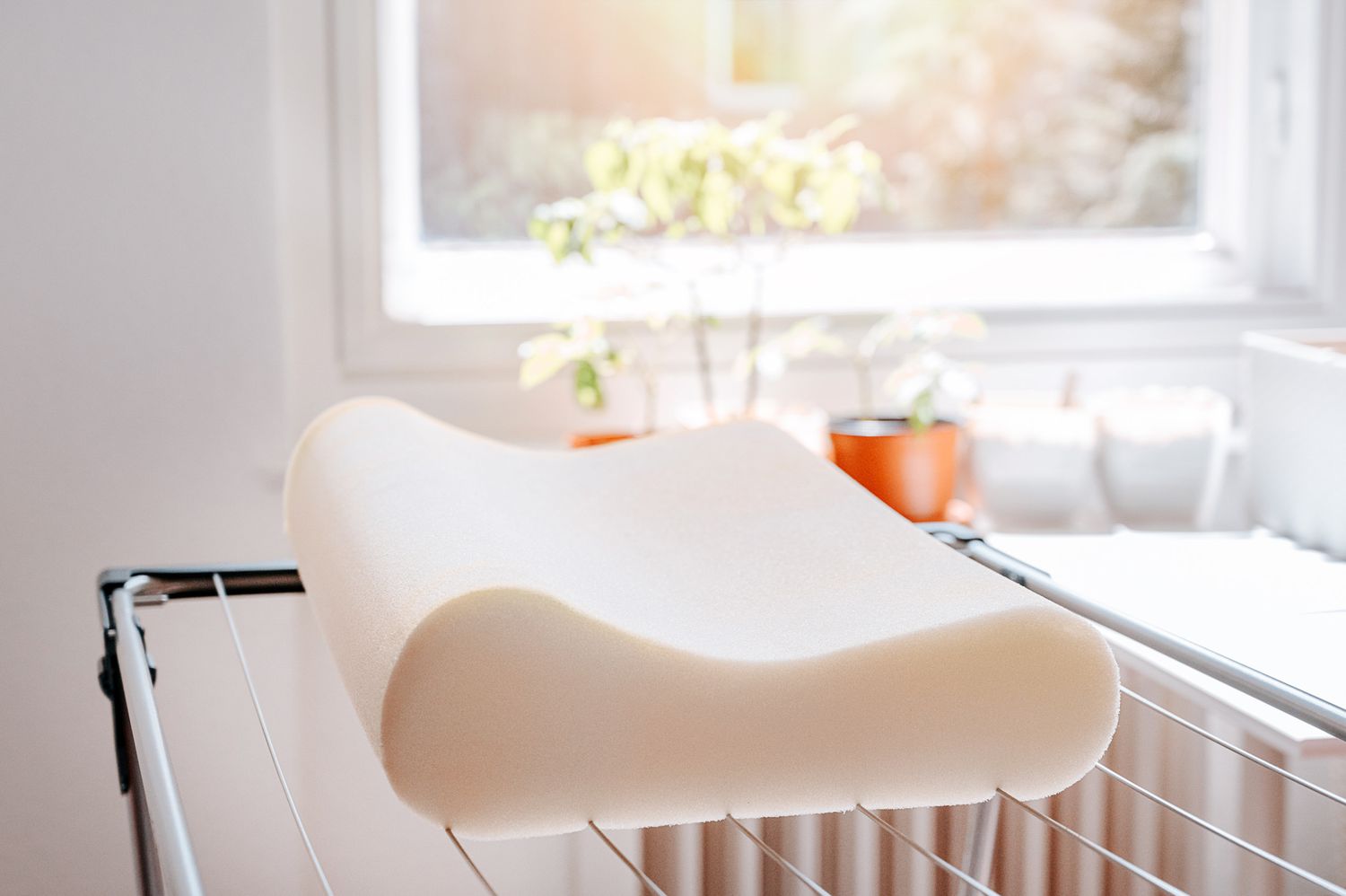 Memory foam pillow air drying flat in a ventilated area
