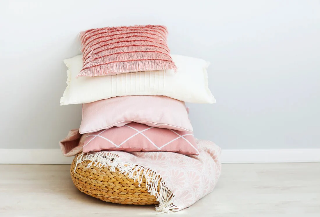 Pillow care label and pillow types being checked before machine washing