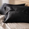 Close view of a black satin pillowcase envelope closure